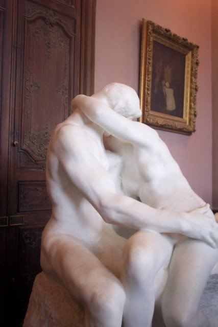 Two lovers, kissing.